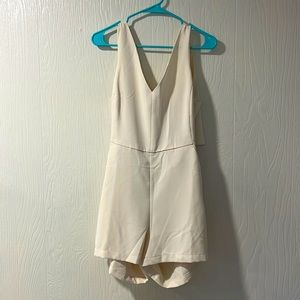 Cream romper, dressy, open back. Nwt